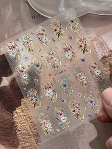 Macro detail of YT7116Pro vintage floral nail stickers with gold stamping and laser effects