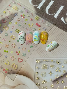 Detail of YT7015 gold foil butterfly nail stickers on colorful embossed display tips