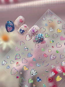 Detailed nail art stickers showing laser heart, checkerboard, and dots pattern on nails