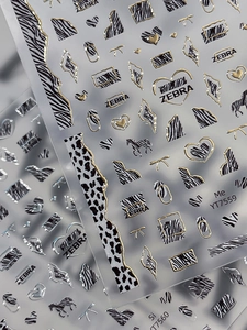 Macro detail of gold embossed zebra pattern nail art stickers with 3D metallic texture