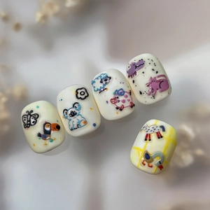 3D relief nail art stickers featuring cute cartoon animal designs on soft pastel bases