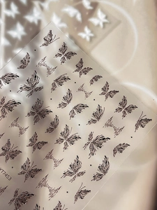 Detail of YT7453 nail art stickers featuring elegant black 3D embossed butterfly patterns