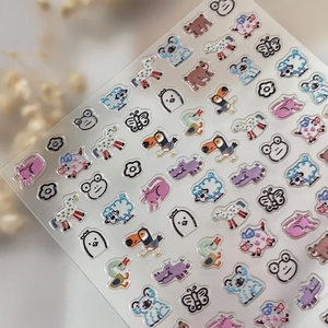 3D embossed cartoon animal nail art stickers featuring cute koalas and colorful pigs