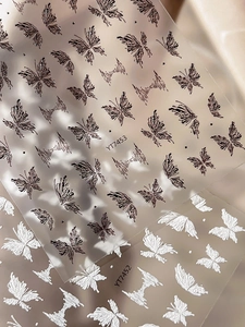 Detail of 3D embossed butterfly nail art stickers in styles YT7452 and YT7453
