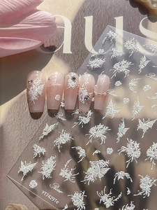 Detailed view of 5D embossed white rose and butterfly nail stickers with a pearl finish