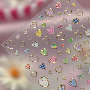 Silver foil heart nail art stickers with colorful plaid and polka dot patterns