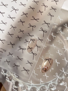 Detailed view of minimalist black and white bow nail art stickers YT7355 and YT7356