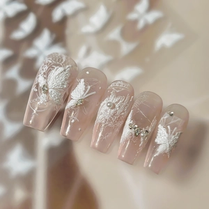 3D white embossed butterfly and lace nail art stickers on nude pink base finish