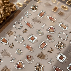Silver embossed frame nail art stickers with vintage newsprint and heart butterfly shapes