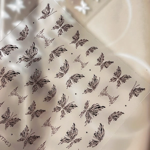 Elegant butterfly nail stickers with silver glitter outlines on silk background YT7453