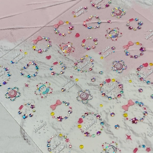 3D-Nagelaufkleber mit rosa Schleifen, Lasersmileys und Regenbogen-Strasssteinen