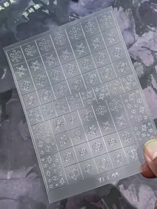 Detail of silver embossed snowflake nail stickers with dual-use transparent design