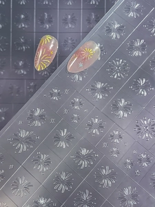 Detailed macro view of colorful firework patterns on transparent nail art stickers