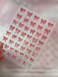 Close-up of 3D pink jelly bow nail art stickers with iridescent finish on YT7219 sheet