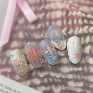 Handmade ballerina style false nails with pink bows, stars and light purple glitter