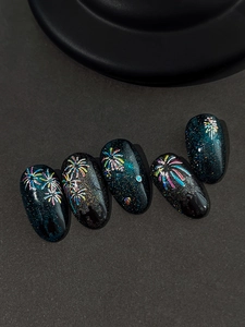 Macro shot of galaxy cat-eye fake nails featuring colorful 5D relief firework patterns