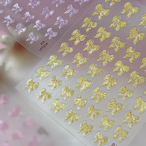 3D embossed bow nail stickers with purple pearls and yellow spotted design for nail art