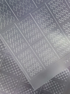 Detailed macro view of 3D embossed geometric checkerboard nail art stickers for DIY design