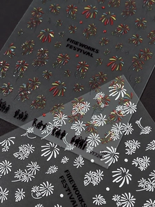 Detailed macro view of 3D embossed firework festival nail art stickers in color and white