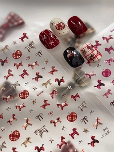 Detail of horse and plaid nail stickers applied on various colored artificial nails