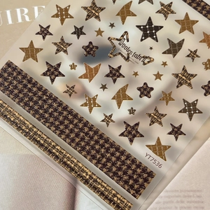 Plaid and star pattern embossed nail art stickers in gold, black, and brown tones