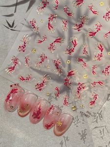 Detail of koi fish nail stickers with gold foil lines and elegant oriental patterns