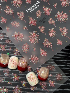 Close-up of 3D firework festival nail stickers with metallic red and gold embossed textures
