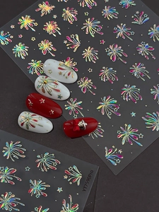 Macro shot of 3D holographic laser nail stickers with glitter firework and star patterns