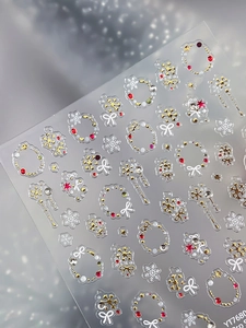 Macro shot of 3D embossed snowflake and Christmas wreath nail art stickers YT7680