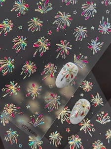 Macro shot of laser fireworks and stars nail stickers with iridescent finish for manicures