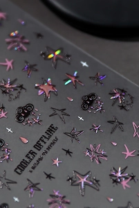 Macro detail of 3D embossed nail stickers with holographic stars and cloud patterns