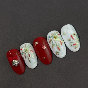 New Year red and white press-on nails with 3D bows, bells, and laser firework patterns