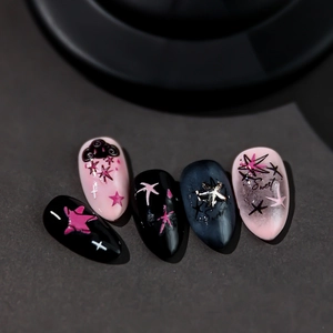 Y2K almond shape press-on nails with 3D cloud charms and sweet star patterns