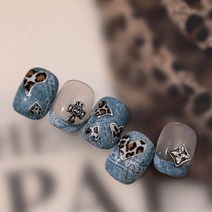 Blue denim and leopard print press-on nails with silver metallic cross charms
