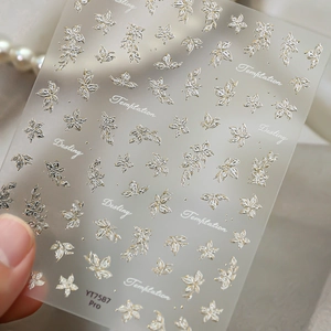 3D silver flower and butterfly nail art stickers with elegant embossed floral patterns