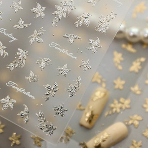 5D embossed nail stickers featuring gold and silver floral and butterfly designs