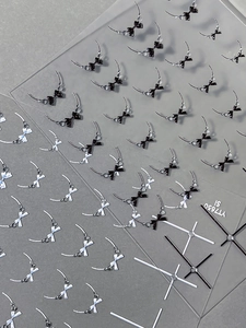 Detailed macro view of black and white bow-knot 3D embossed nail art stickers YT7650
