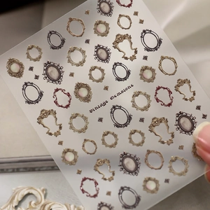 Vintage frame embossed nail stickers with gold and bronze gemstone designs for nail art deco