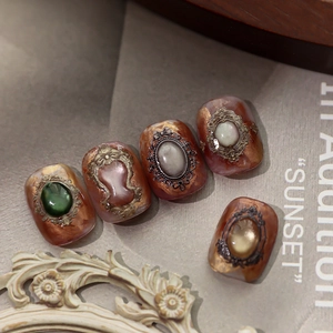 Baroque style embossed nail stickers with vintage amber tones and gemstone accents