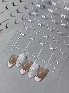 Detailed 3D embossed bow and pearl nail art stickers with minimalist cross lines