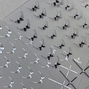 3D embossed nail art stickers featuring chic black and silver bows and star designs