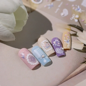 3D floral embossed nail art stickers with pearls and ribbons in soft pastel colors