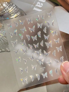 Detail showing 3D aurora butterfly nail art stickers with iridescent holographic effects