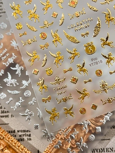 Macro shot of celestial horse nail stickers with 3D gold and silver embossed metallic finish