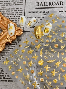 Detailed view of 3D gold celestial horse nail stickers with winged stars and retro motifs