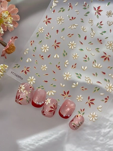 Macro detail of YT7569Pro floral nail stickers with gold foil edges on light pink base