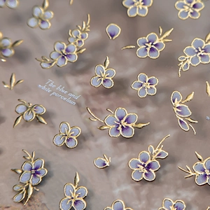 Blue and white porcelain style nail stickers with purple flowers and gold 3D embossed edges