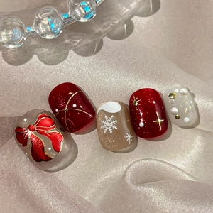 Christmas bow nail art stickers featuring red and gold 3D snowflake designs