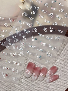 Floral nail art stickers YT7700 and YT7701 applied on pink ombre manicure