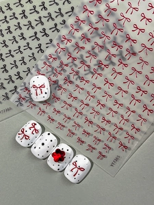 Detailed 3D embossed bow nail art stickers with vintage red and black pattern designs